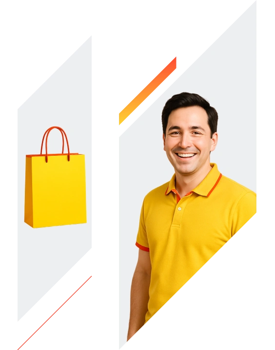 A smiling man in a yellow shirt next to a yellow shopping bag.